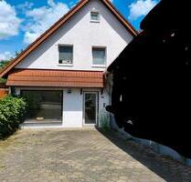 Doppelhaushälfte mit Ladengeschäft und Garten in Melle Mitte