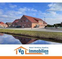 Erstbezug: Großzügige Oberwohnung mit Carport in Kanallage von Großefehn