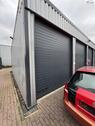 Foto - Gewerbegrundstück mit Stellflächen, Waschplatz und großer Werkstattgarage.