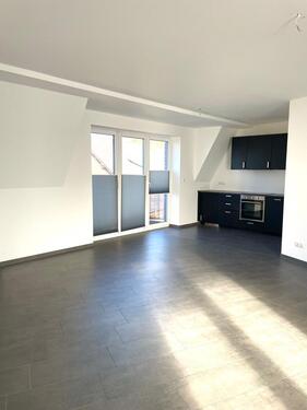 Foto - Moderne Dachgeschosswohnung in zentraler Lage mit Balkon