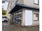 Foto - Helle Eck-Gewerbefläche mit großer Fensterfront – ideal für Laden