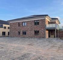 Erstbezug: 3-Zi Whng mit EB-Küche, Terrasse und kleinem Garten - Twistringen