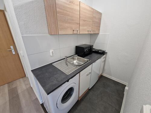Foto - Ab 06.11. ruft diese fantastische 1,5-Zimmer-Wohnung mit EBK im Erdgeschoss!
