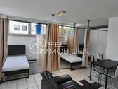 Foto - Modernes, möbliertes 1-Zimmer-Apartment mit großer Terrasse und Tiefgaragenstellplatz in