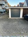 Foto - Garage mit einem Stellplatz davor