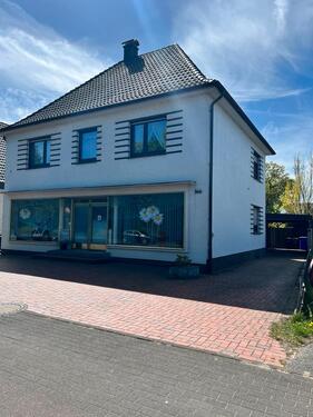 Foto - Einfamilienhaus mit vermieteter Gewerbefläche in Gütersloh