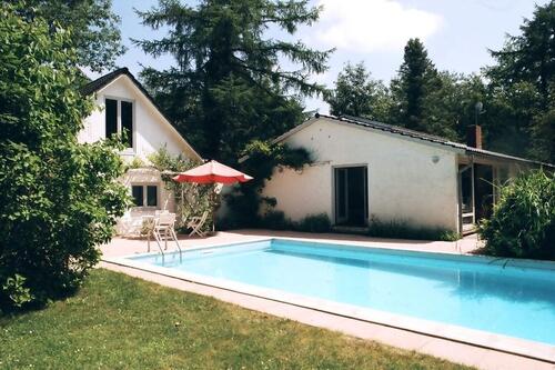 Foto - Ferienhaus Zaun mit Hund Ostsee Nordsee Fehmarn Rügen Last Minute