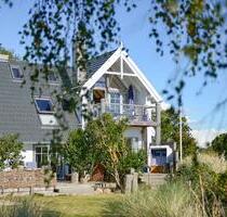 Ferienwohnung Westwind auf Fehmarn - Meerblick, Kamin & Sauna