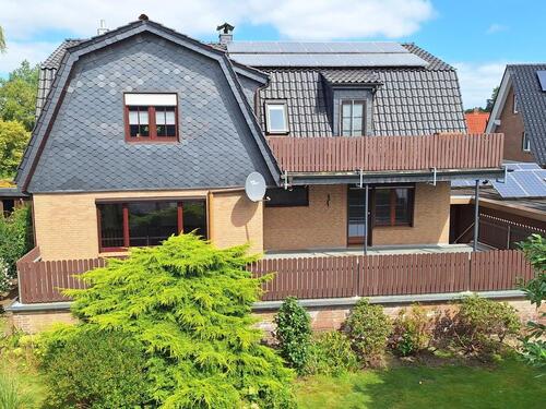 Foto - Erdgeschosswohnung mit Keller, Terrasse, Garage und Garten