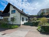 Foto - Einfamilienhaus mit 6 Zimmer, Gartenanteil, Garage mit Grube
