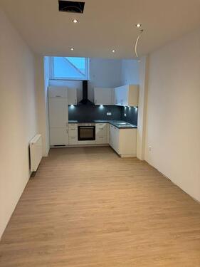 Foto - Erstbezug nach Sanierung – 2 Zimmer mit offener Küche & Dachterrasse in zentraler Innenstadtlage