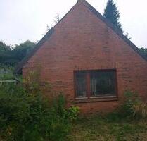 Kleines Haus auf großem Grundstück mit Garage zu verkaufen - Rieseby