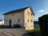 Foto - Einfamilienhaus mit effizienter Strom-Warmluftheizung