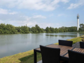 Foto - Ferienhaus in Tossens direkt am Deich mit Terrasse zum See