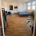 Foto - Helle Altbauwohnung mit offenem Grundriss und Studio-Stil – zentr