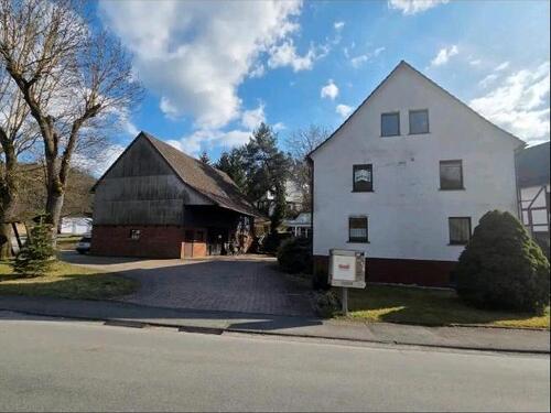 Foto - Mehrfamilienhaus mit Einliegerwohnung und Baugrundstück