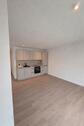 Foto - Erstbezug: 2,5-Zimmer-Wohnung mit Einbauküche, Aufzug und Garage