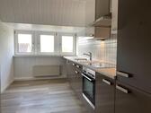 Foto - Helle DG-Wohnung mit Einbauküche und Garage in beliebter Lage