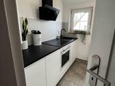Foto - Renovierte 3-Zimmer-DG-Wohnung mit EBK und privatem Gartenanteil