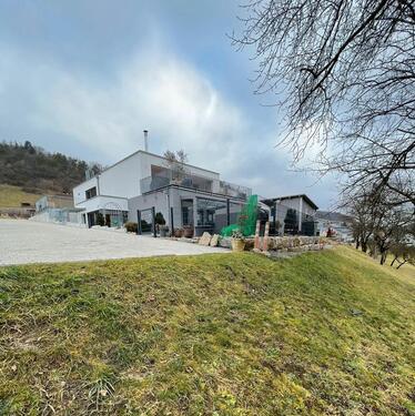 Foto - Moderne Gartengeschosswohnung mit Wintergarten und Garten