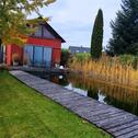 Foto - Einfamilienhaus mit Schwimmteich und carport
