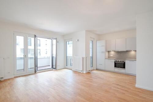 Foto - Moderne 2-Zimmerwohnung mit Einbauküche und großzügiger Terrasse.