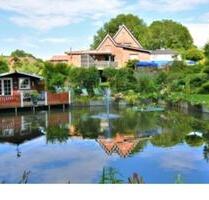 Gepflegtes Einfamilienhaus mit großem Garten und Schwimmteich - Tellingstedt Gepflegtes Einfamilienhaus mit großem Garten und Schwimmteich - Tellingstedt