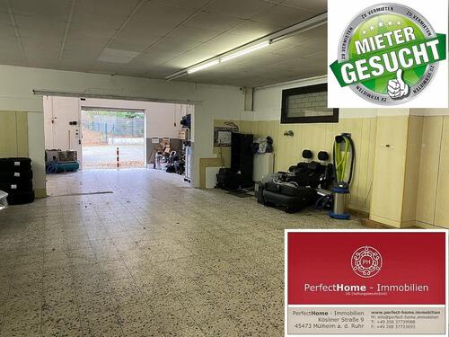 Foto - Gewerbehalle Lager mit Eingangstüre und Rolltor, ebenerdige Zufahrt möglich.