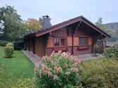 Foto - Gemütliches Holzblockhaus mit schönem Garten