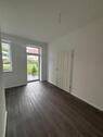 Foto - Moderne 1-Raum-Erdgeschosswohnung mit überdachter Terrasse