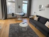 Foto - Voll möbliertes 1-Zimmer-Apartment mit Einbauküche in zentraler L