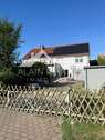 Hausansicht mit PV - 6 Zimmer Einfamilienhaus zum Kaufen in Schönwölkau