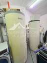 Hauswirtschaftsraum mit Erdwärmepumpe und Speicher - 