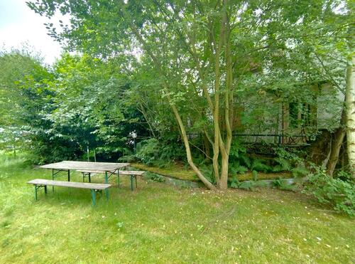 Gartenblick des noch ungeteilten Grundstücks zurück - 5 Zimmer Baugrundstück in Köln