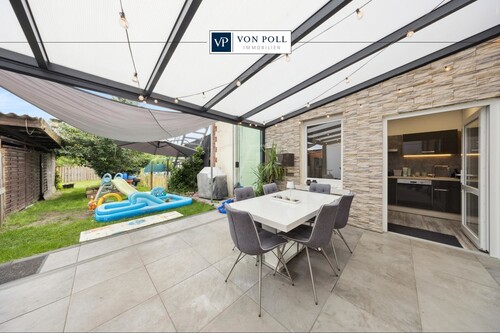 Titelbild - Auf die Plätze, fertig, einziehen! Modernisierte Erdgeschosswohnung im Zweifamilienhaus