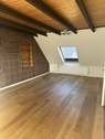 Wohnzimmer - gemütliche Dachgeschosswohnung im Zentrum von Aschendorf