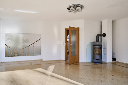 Das Wohnzimmer mit Kaminofen - 