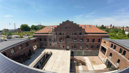 Drohnenaufnahme - ATIK: Neubau mit Holzmassivdachstuhl im historischen Bahn-Betriebswerk Heidelberg