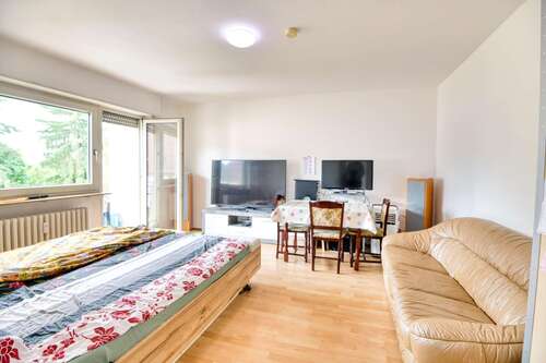 Wohnzimmer 1 - 2 Zimmer Terrassenwohnung zum Kaufen in Mannheim