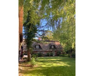 Traumhaftes Reetdach-Ein-Zweifamilienhaus mit parkähnlichem Garten in Angeln - Scheggerott