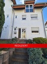 Hausansicht - vermietetes Reihenendhaus mit kleinem Grundstück als lukrative Investitionsmöglichkeit