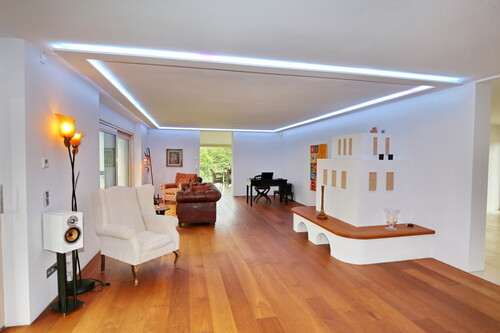 Wohnbereich mit Kachelofen - Villa mit 245,00 m² in Baden-Baden zum Kaufen