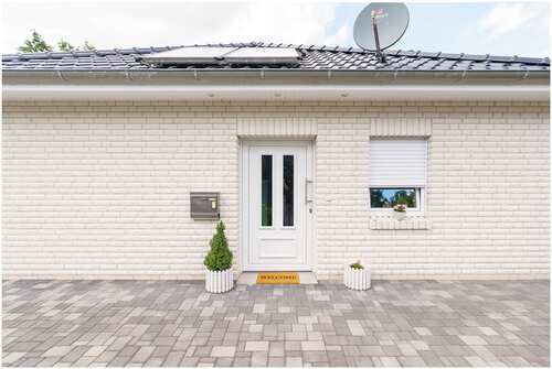 Eingangstür - Bungalow mit 99,00 m² in Westoverledingen zum Kaufen