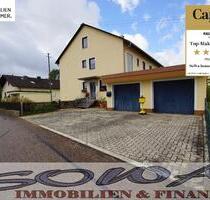 Schönes Zweifamilienhaus mit zwei Garagen aus einem großzügigen Grundstück - Ein Objekt von Ihrem Immobilienpartner SOWA Immobilien und Finanzen - Münchsmünster
