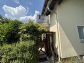 Hausansicht mit Blick zur Terrasse - 4 Zimmer Maisonettenwohnung in Coswig