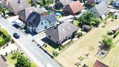 Das Wohnhaus aus der Vogelperspektive - Bungalow mit 127,00 m&sup2; in Stolzenau zum Kaufen