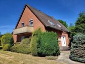seitliche Ansicht mit Hauseingang - 9 Zimmer Mehrfamilienhaus, Wohnhaus zum Kaufen in Marklohe