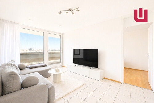 Wohnzimmer - WINDISCH IMMOBILIEN - Vermietete 2-Zimmerwohnung im 12. OG im Olympiadorf