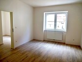 Wohn- und Schlafzimmer - Großzügige 1,5-Zimmer-Wohnung in zentrumsnahem KFW-Effizienzhaus (Mietdauer: min 4 Jahre)