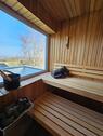 Blick aus der Sauna - Provisionsfrei* Exklusives Wohnen am Teutoburger Wald - Modernes Einfamilienhaus mit Sauna, Kamin & kleinem Garten